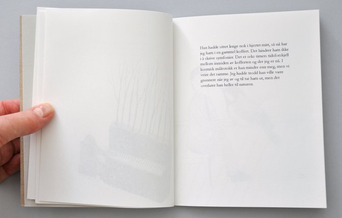 Overview of handmade artists book with short peotic texts. Photography.